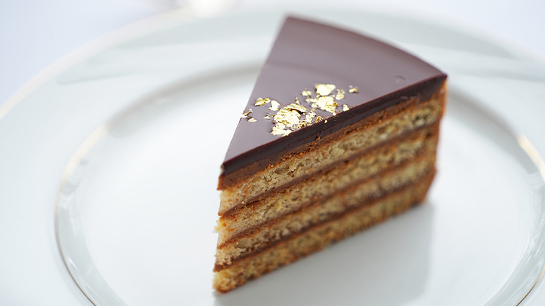 Piece of opéra cake on white plate