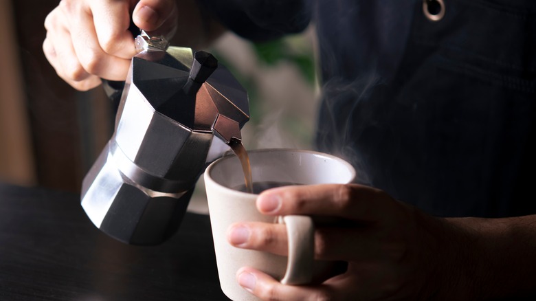 Pouring coffee from moka pot