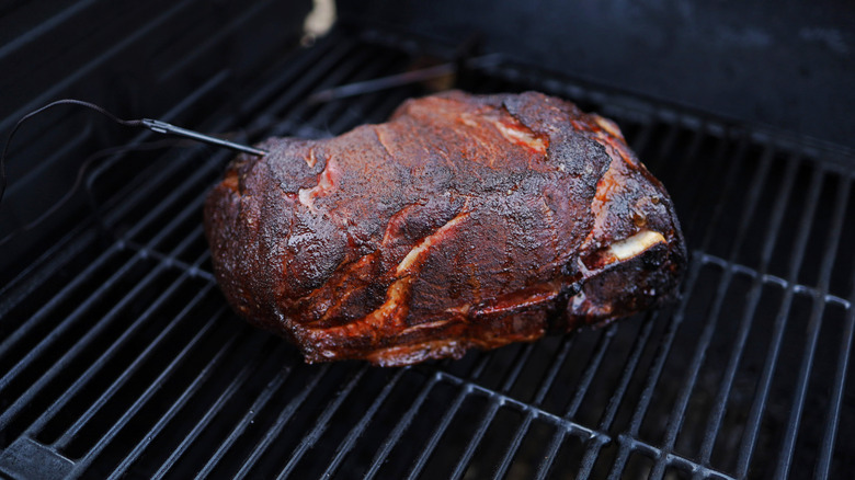 Pork butt in a smoker