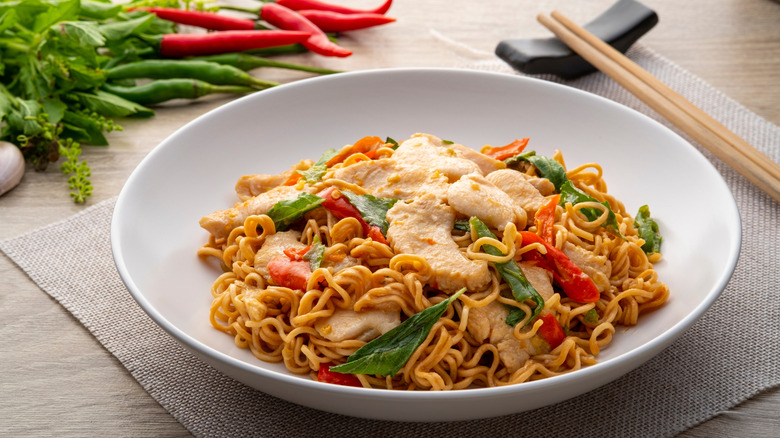 Pork stir-fry in a wide, shallow bowl