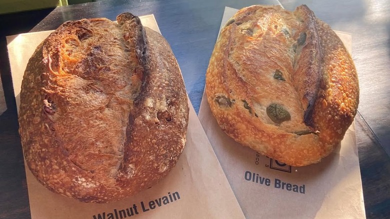 two sourdough loaves on counter from Acme Bread Company bakery