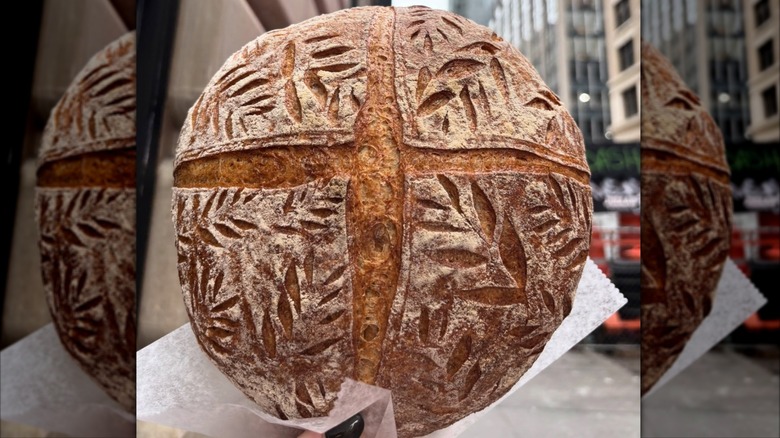 hand holding decorated at Bourke Street Bakery in NYC
