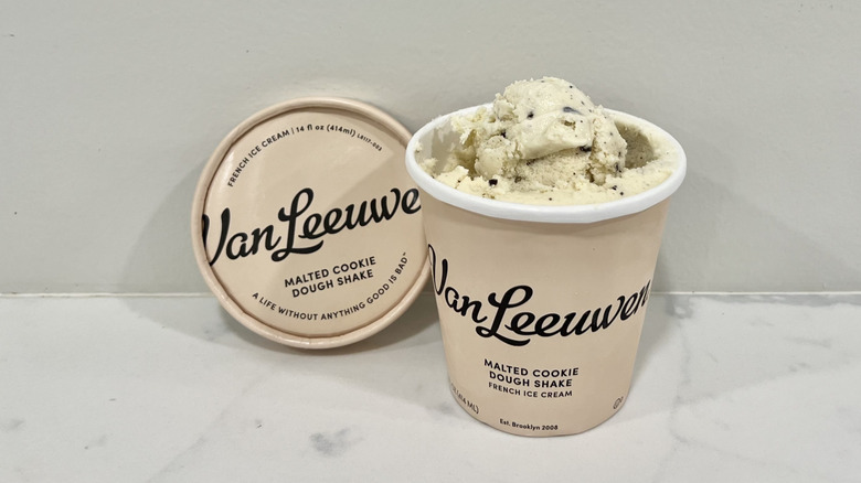 Opened Van Leeuwen malted cookie dough shake ice cream pint on a countertop