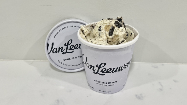 Opened Van Leeuwen cookies and cream ice cream pint on a countertop