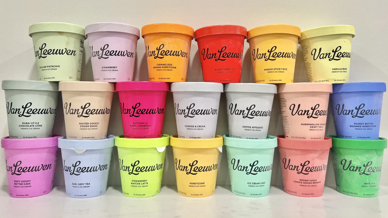 20 different colorful pints of Van Leeuwen ice cream stacked on a countertop