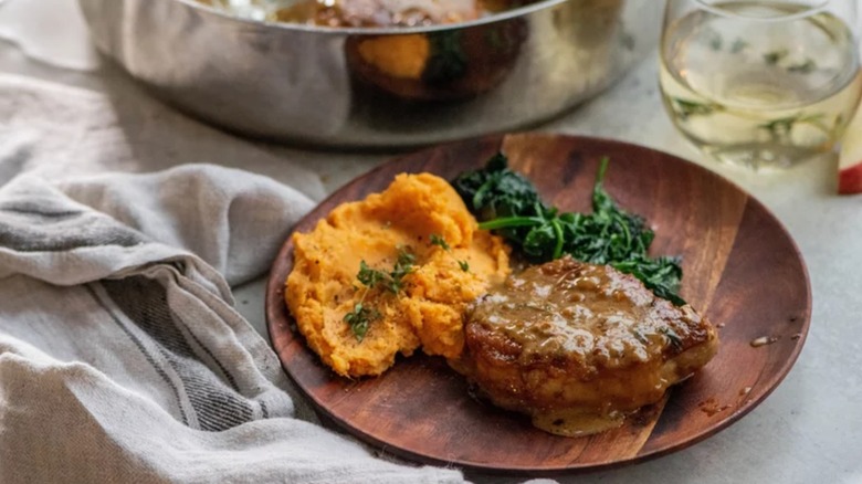 Apple cider pork chop on plate