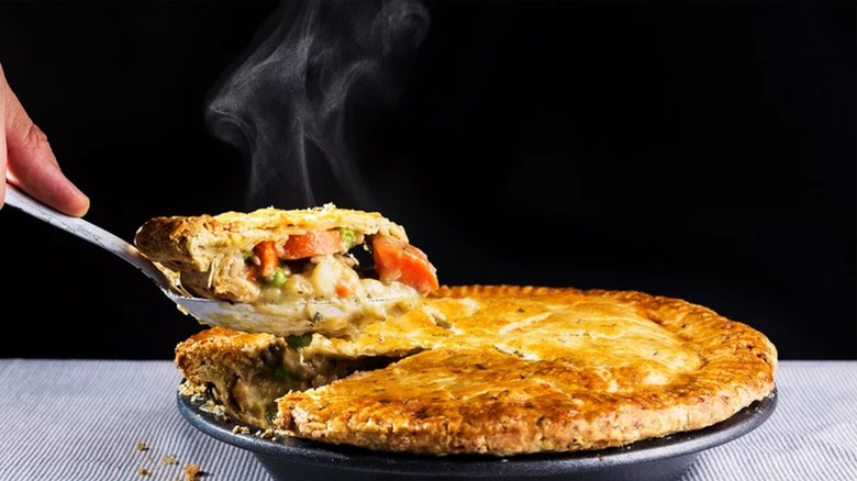 Lifting slice of chicken pot pie
