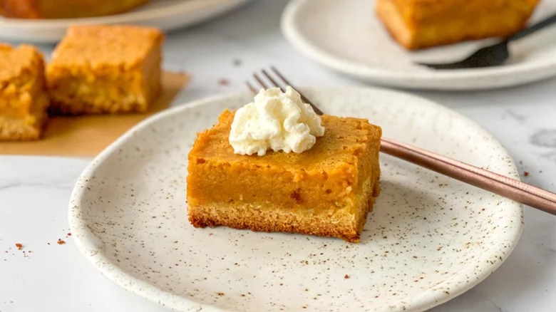 Slice of pumpkin gooey butter cake on plate