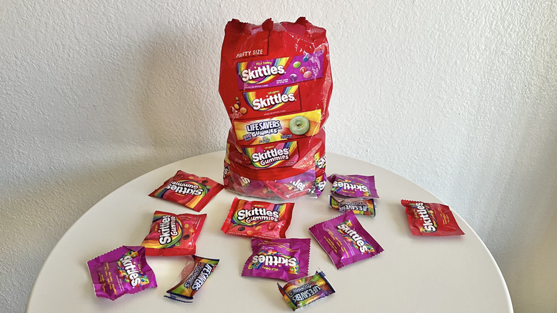 Skittles and Life Savers candy variety pack on a small table