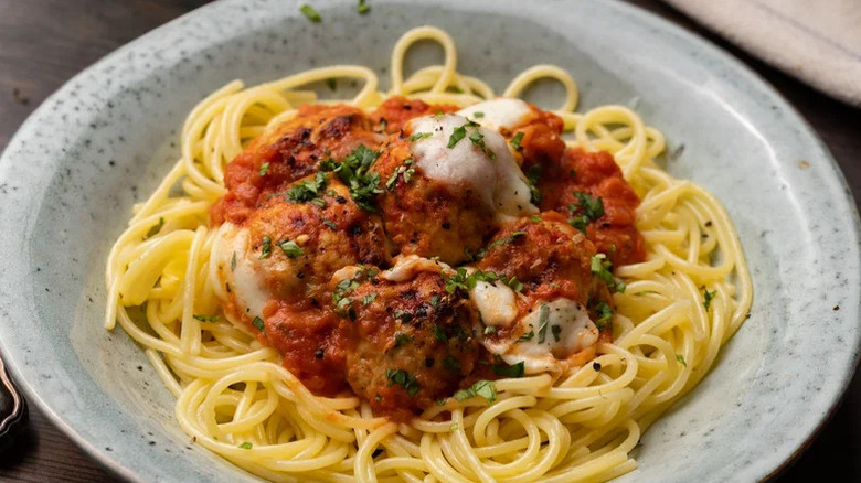Baked Turkey Meatball over spaghettit