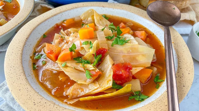 Old-Fashioned Cabbage Soup with a metal spoon