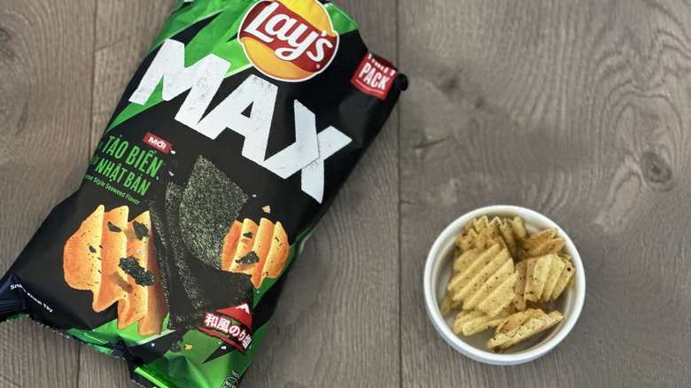 Overhead image of bag of Lay's Japanese Style Seaweed flavored potato chips with small white ramekin filled with chips