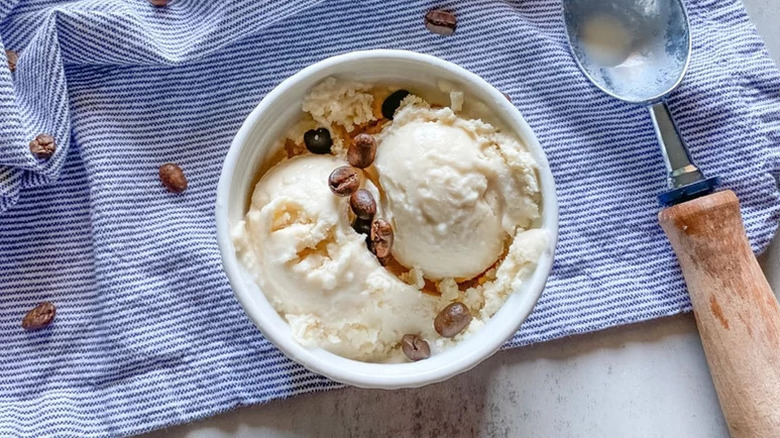 Coffee Gelato in white bowl on blue striped towel