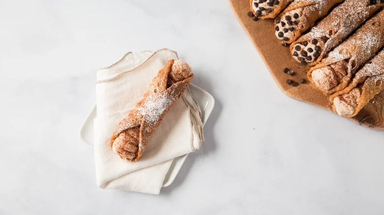Tiramisu Cannoli on white napkin and plate