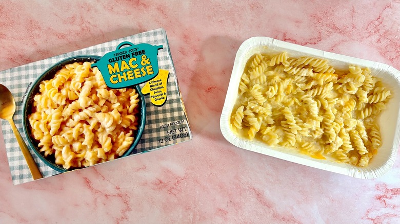 Trader Joe's gluten free mac and cheese next to box on pink surface