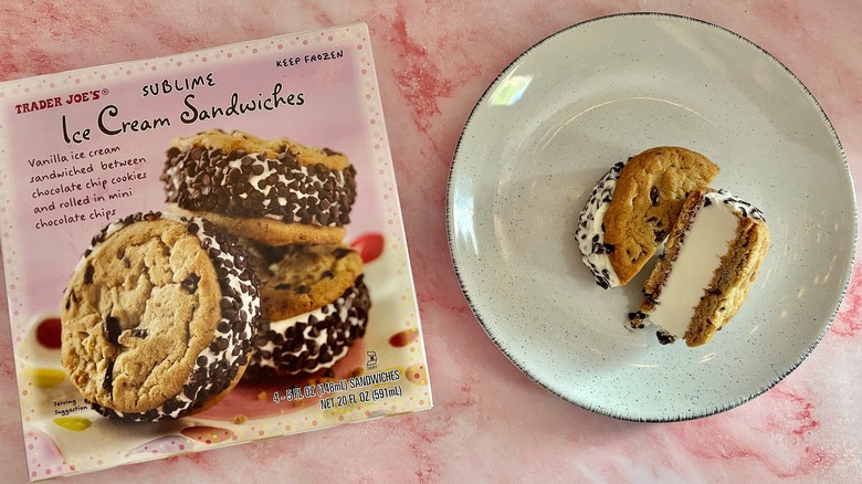 Trader Joe's Sublime ice cream sandwich on plate next to box on pink marble surface