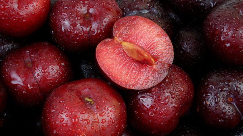 Pile of sliced and halved plums