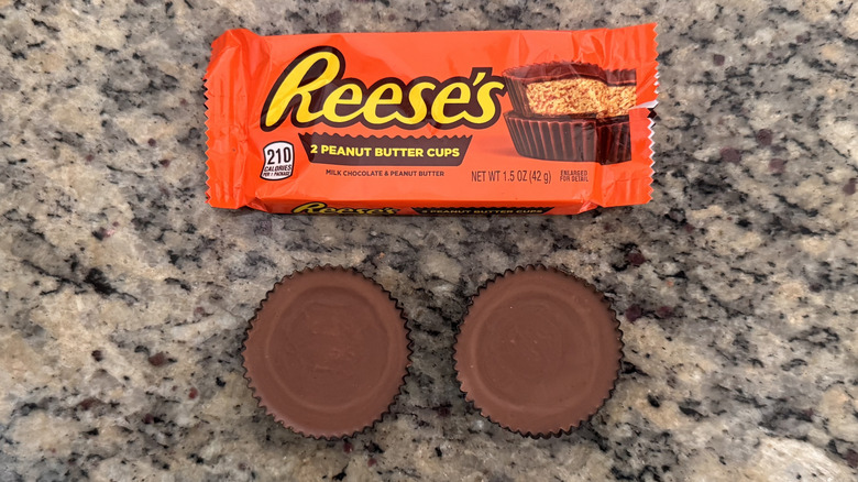 pair of Reese's cups beside wrapper on counter