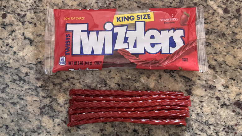 several twizzlers on counter beside package