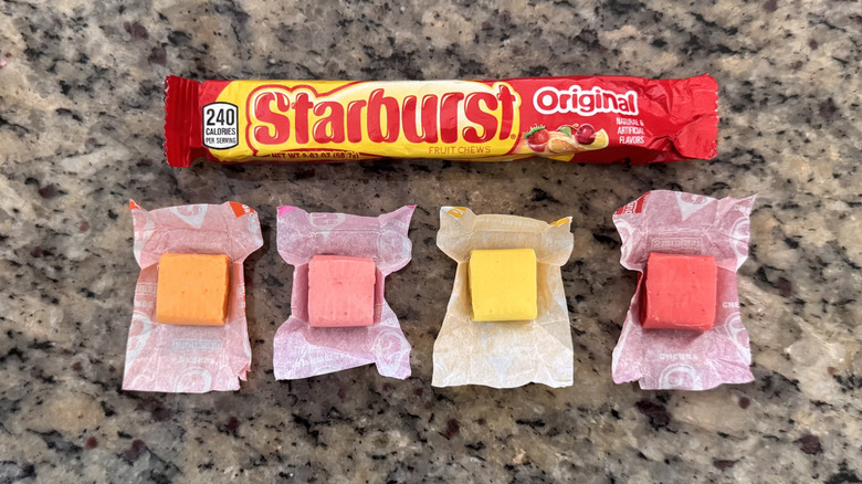 package of starburst with each candy flavor unwrapped on counter
