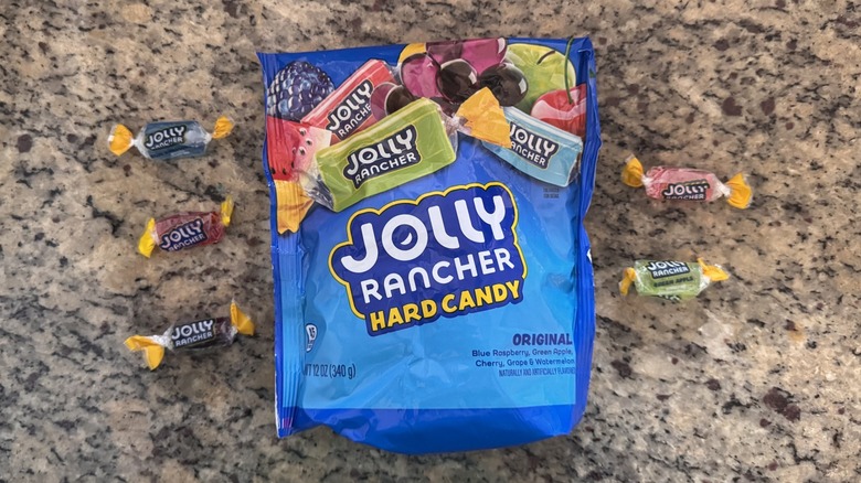 Bag of Jolly ranchers with each flavor displayed beside it