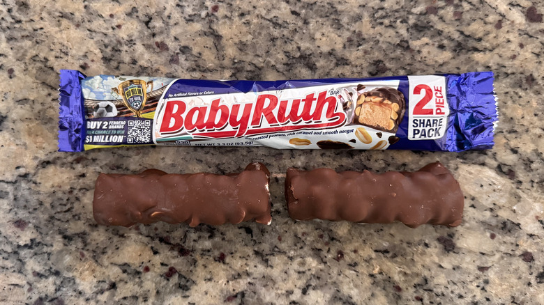 baby ruth candy bar pieces beside wrapper on counter