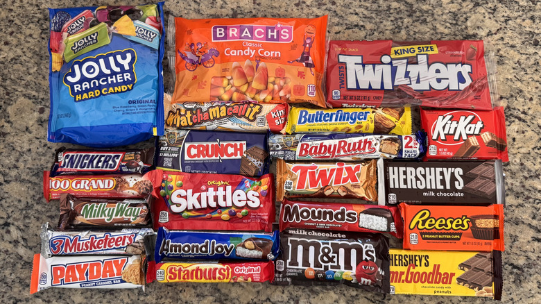 22 different iconic candy bars and products displayed on counter