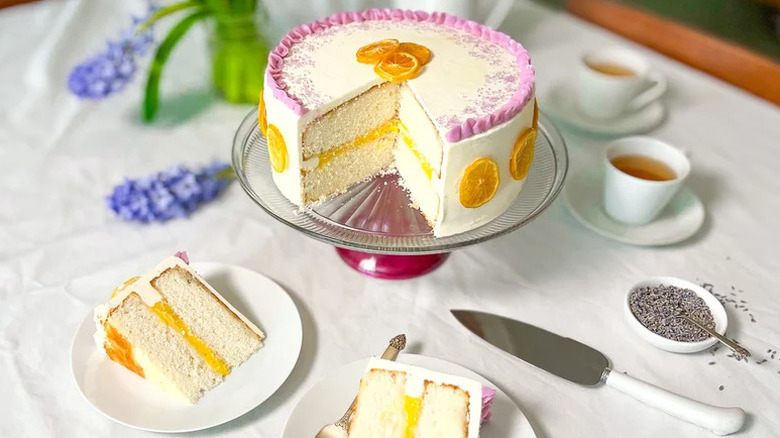A lemon lavender cake with a piece on a plate