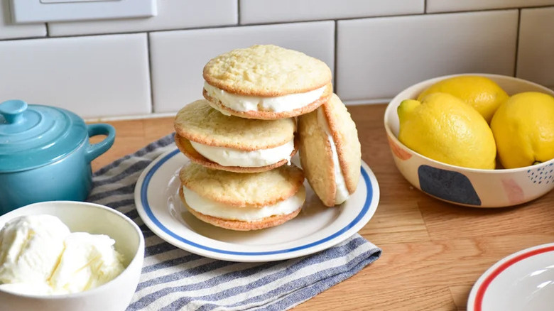 Lemon ice cream sandwiches stacked on the plate