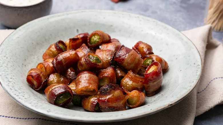 Plate of bacon-wrapped balsamic Brussels sprouts in a pile