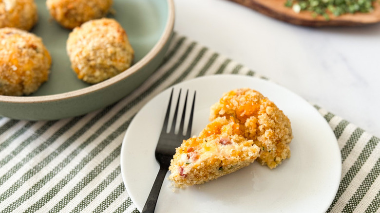 Crispy air fryer mashed potato balls in bowl and on plate