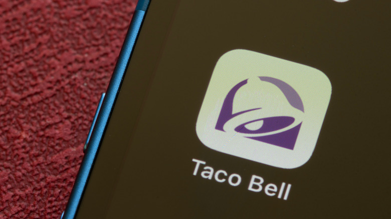Phone with Taco Bell app icon