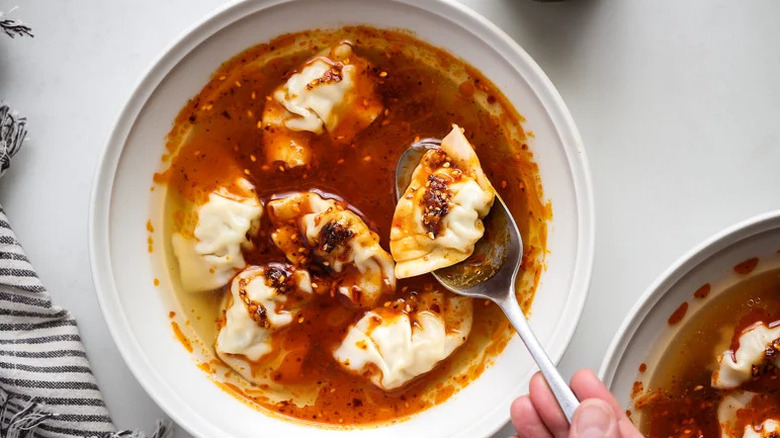 3-Ingredient Wonton Soup with spoon in white bowl