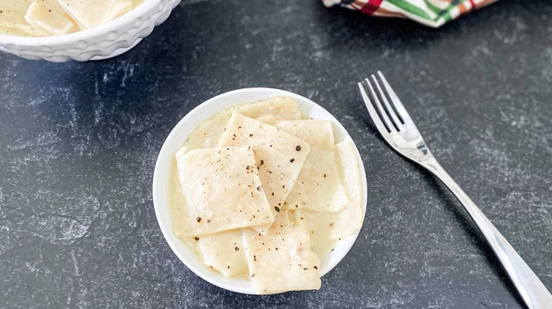 Copycat Cracker Barrel Dumplings in small bowl on black countertop