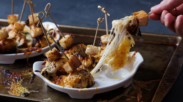 French Onion Soup Dumplings with cheese on toothpicks