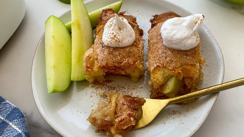 Mini Apple Dumplings on white plate with gold fork