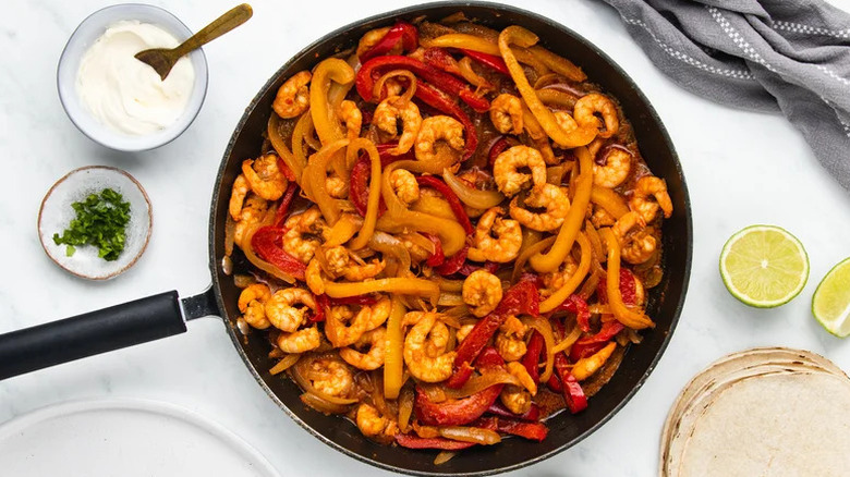 Sizzling Shrimp Fajitas in black skillet