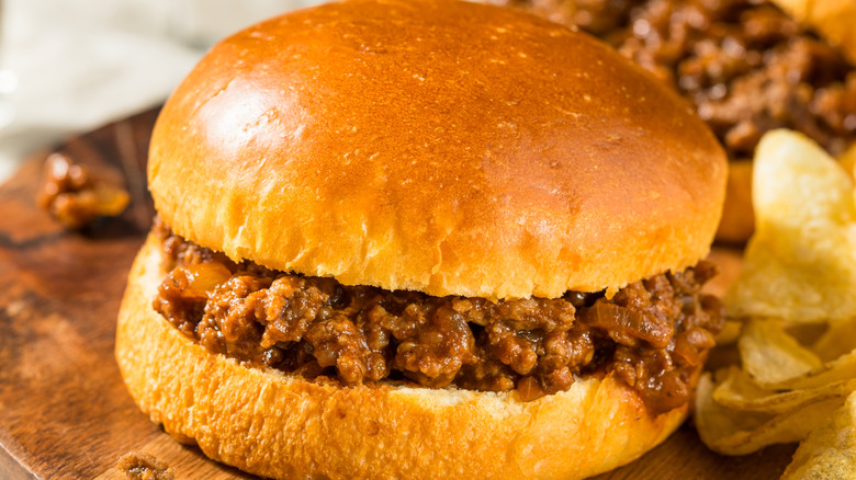 close up of a sloppy Joe sandwich with beef oozing out