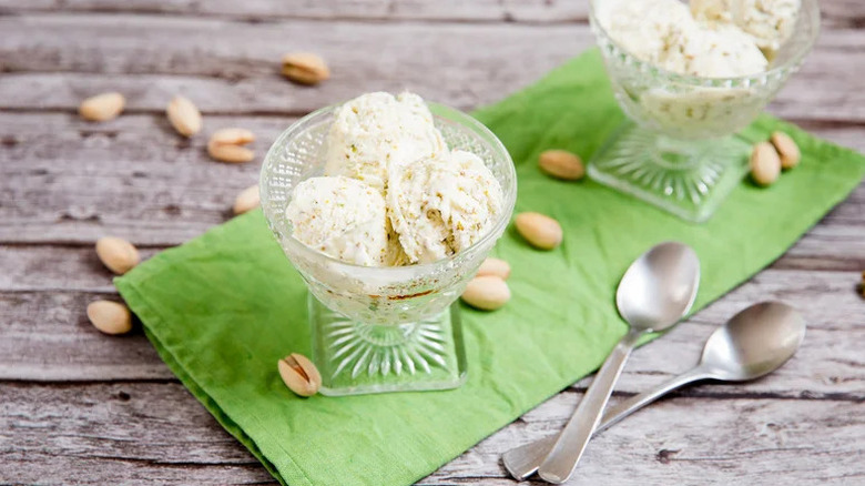 The Best 3-Ingredient Pistachio Ice Cream in glass goblets on green towel