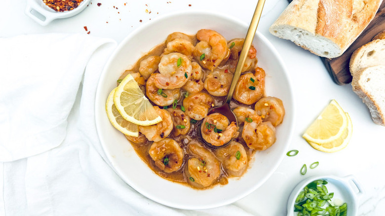 Miso butter shrimp in bowl with lemon slices