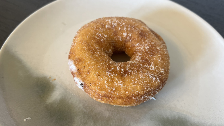 Duck Donuts cinnamon sugar donut on plate.