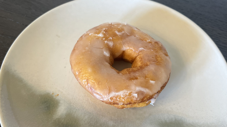 Duck Donuts glazed donut on plate.
