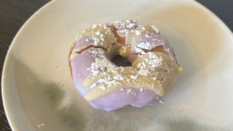 Duck Donuts Blueberry Pancake donut on plate.