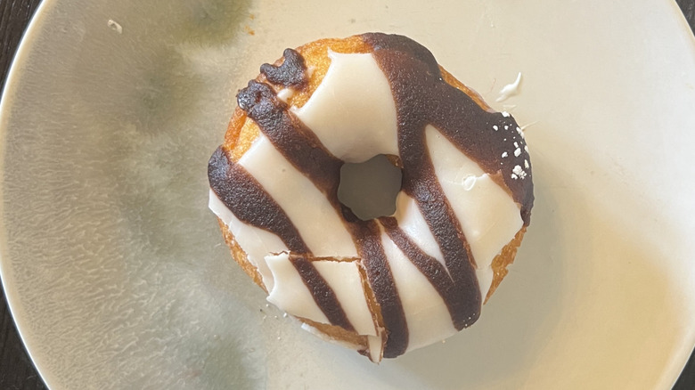 Duck Donuts Peanut Butter Paradise donut on plate.