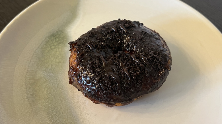 Duck Donuts Chocolate Explosion donut on plate.