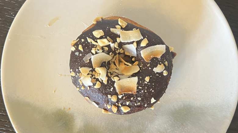 Duck Donuts Coconut Island Bliss donut on plate.