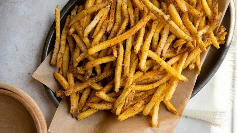 Baked Wingstop-style fries served on brown parchment paper
