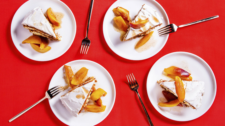 Slices of ginger-peach icebox pie on four plates
