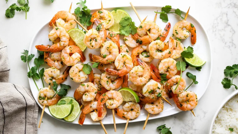 3-Ingredient Cilantro Lime Shrimp Skewers on white plate