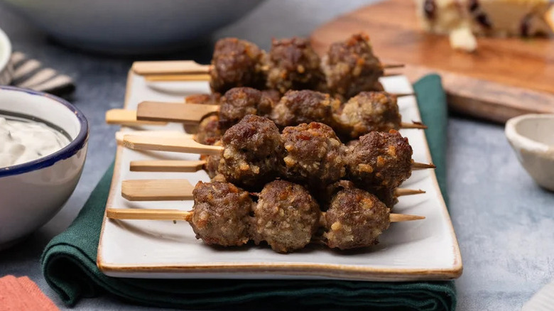 Broiled Mini Meatball Skewers on white plate
